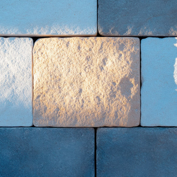 Pattern of blue and beige tiles with a focus on texture and color.